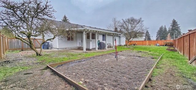 view of yard featuring a patio area and a fenced backyard