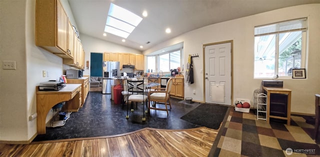 kitchen with dark wood-style floors, recessed lighting, stainless steel appliances, baseboards, and lofted ceiling