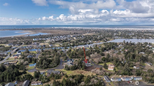 drone / aerial view featuring a water view