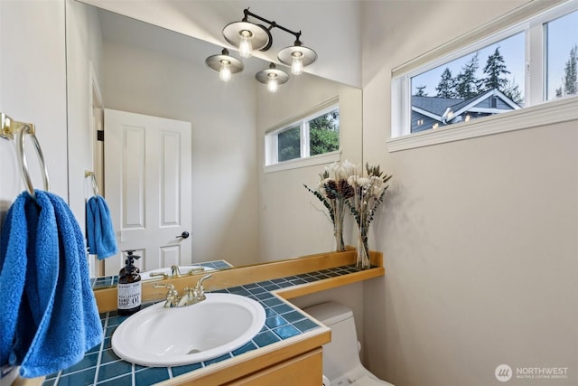 half bath with vanity and toilet