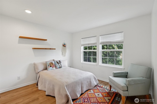 bedroom with recessed lighting, baseboards, and light wood-type flooring