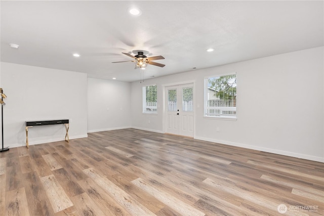 unfurnished living room featuring recessed lighting, baseboards, ceiling fan, and wood finished floors