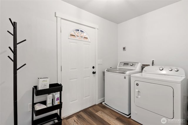 laundry room featuring laundry area, independent washer and dryer, and wood finished floors