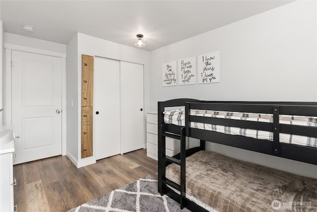 bedroom featuring a closet and wood finished floors