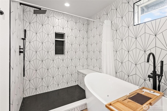 full bathroom featuring tile walls, a soaking tub, recessed lighting, and a tile shower