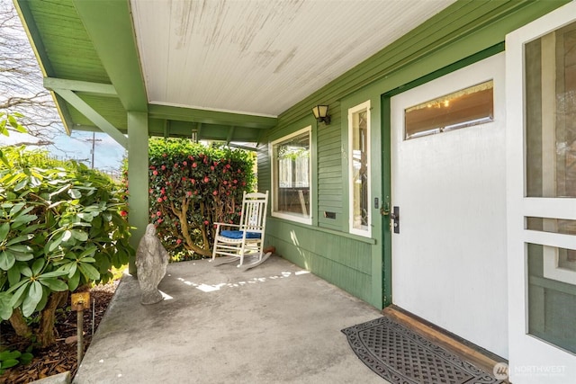 doorway to property featuring a porch
