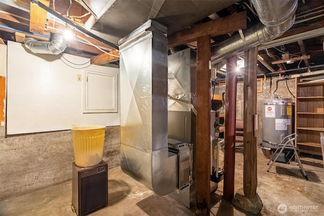 unfinished basement featuring heating unit and water heater