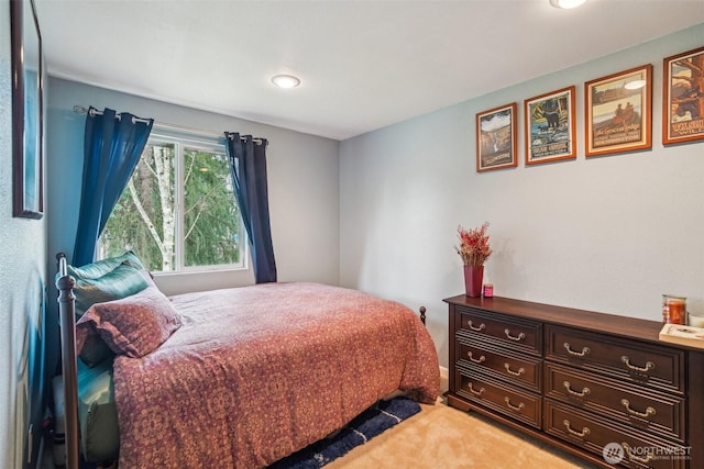 bedroom featuring light carpet and recessed lighting