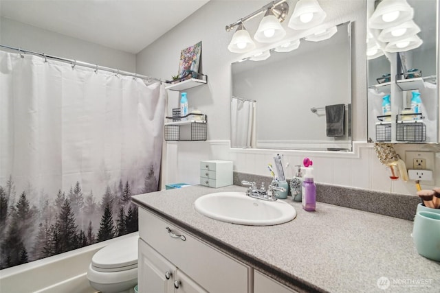 full bathroom with toilet, shower / tub combo with curtain, and vanity