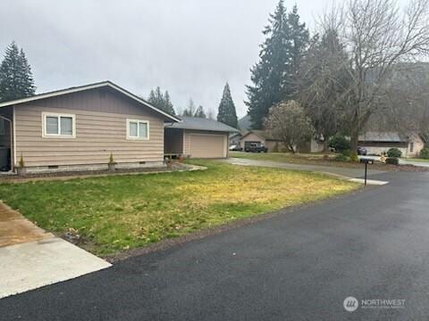 310 Kosmos Ln, Morton, WA 98356 - ranch-style house featuring a front lawn, crawl space, a garage, an outbuilding, and driveway