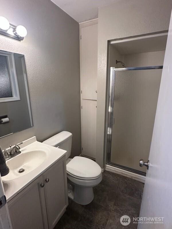 310 Kosmos Ln, Morton, WA 98356 - full bathroom with vanity, toilet, and a stall shower