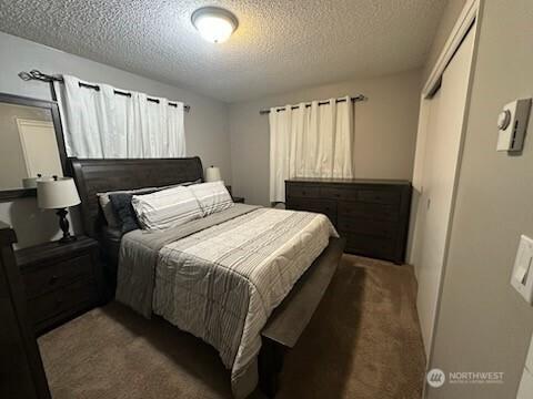310 Kosmos Ln, Morton, WA 98356 - bedroom featuring a textured ceiling and carpet flooring