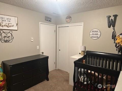310 Kosmos Ln, Morton, WA 98356 - bedroom featuring carpet flooring, a closet, and a textured ceiling