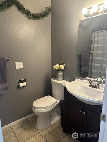 310 Kosmos Ln, Morton, WA 98356 - bathroom featuring baseboards, toilet, a shower with shower curtain, tile patterned floors, and vanity
