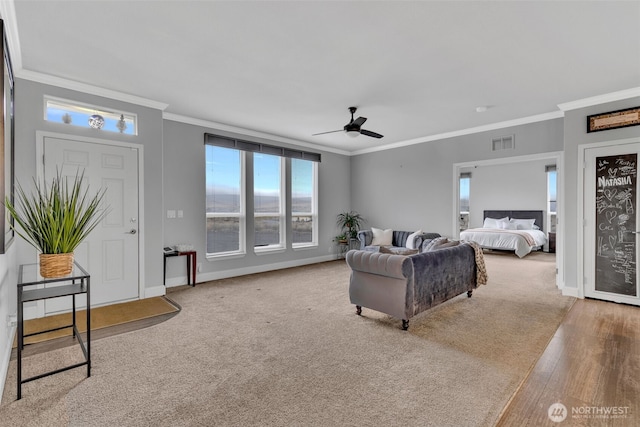 404 Airport Way SW, Mattawa, WA 99349 - living room featuring carpet, baseboards, a ceiling fan, visible vents, and ornamental molding