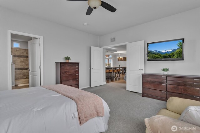 404 Airport Way SW, Mattawa, WA 99349 - carpeted bedroom featuring visible vents, ensuite bathroom, and ceiling fan with notable chandelier