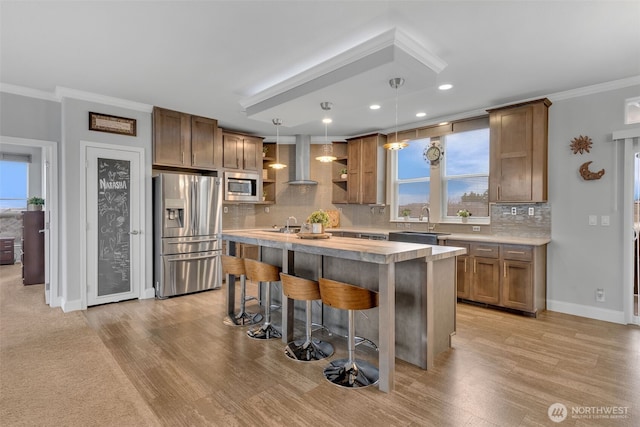 404 Airport Way SW, Mattawa, WA 99349 - kitchen with open shelves, light countertops, appliances with stainless steel finishes, crown molding, and wall chimney range hood