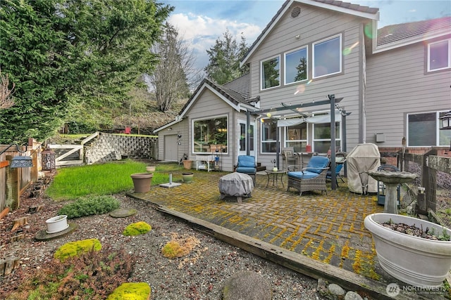 back of property with a fenced backyard and a patio area