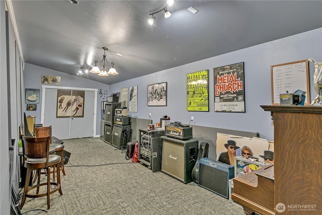 interior space with lofted ceiling, carpet floors, and a chandelier