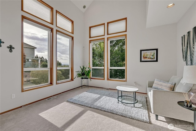 sitting room with visible vents, lofted ceiling, recessed lighting, carpet, and baseboards