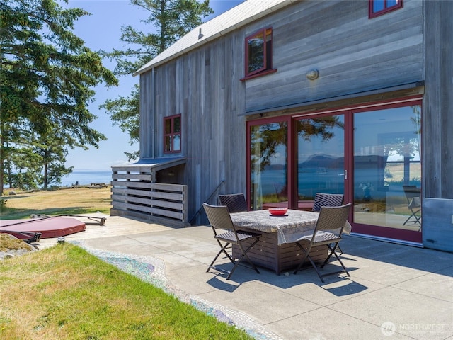 146 E Meadow Ln, Decatur Island, WA 98221 - view of patio with a jacuzzi and outdoor dining space