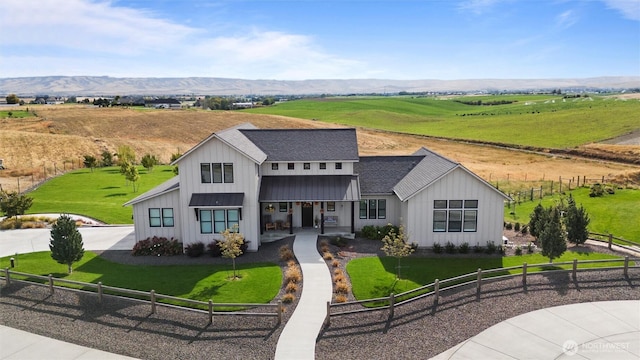 125 Ponderosa Ct, Walla Walla, WA 99362 - modern farmhouse featuring a fenced front yard, covered porch, board and batten siding, and roof with shingles