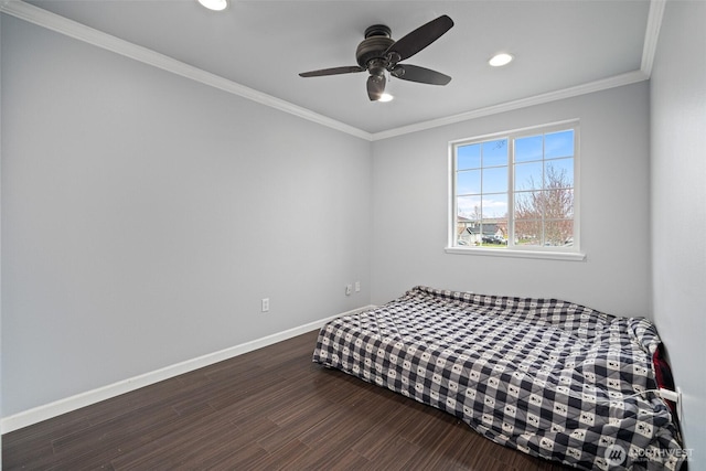 bedroom with ornamental molding, a ceiling fan, wood finished floors, recessed lighting, and baseboards