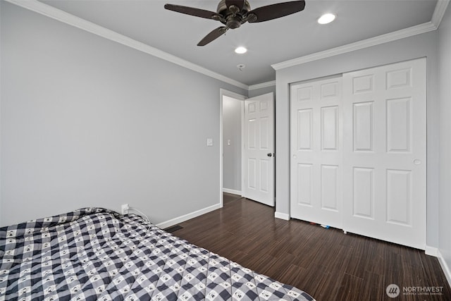 unfurnished bedroom with visible vents, crown molding, dark wood-type flooring, and baseboards