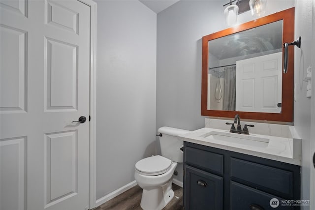 full bathroom with baseboards, toilet, a shower with shower curtain, wood finished floors, and vanity