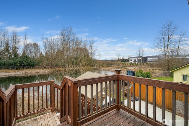 wooden deck with a water view