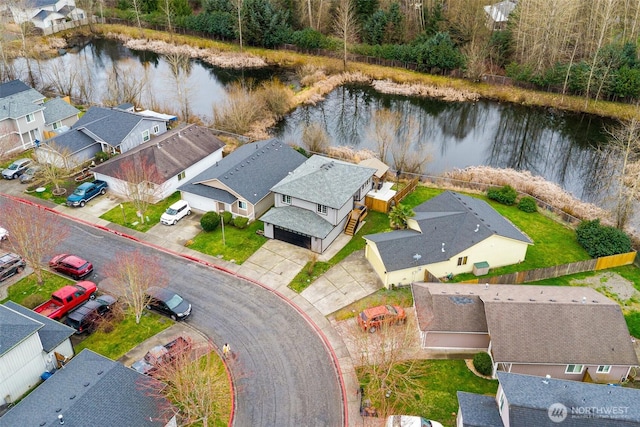 aerial view with a residential view and a water view