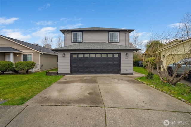 traditional home with a front yard, a garage, and a shingled roof