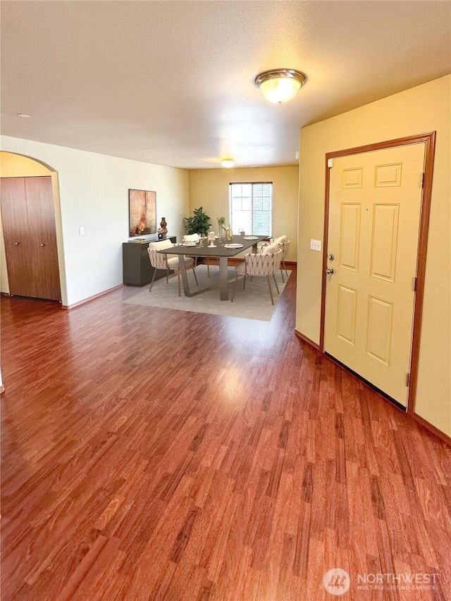 living area featuring a textured ceiling and wood finished floors