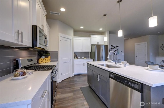 12225 SE 271st Pl, Kent, WA 98030 - kitchen featuring white cabinets, a sink, appliances with stainless steel finishes, and visible vents