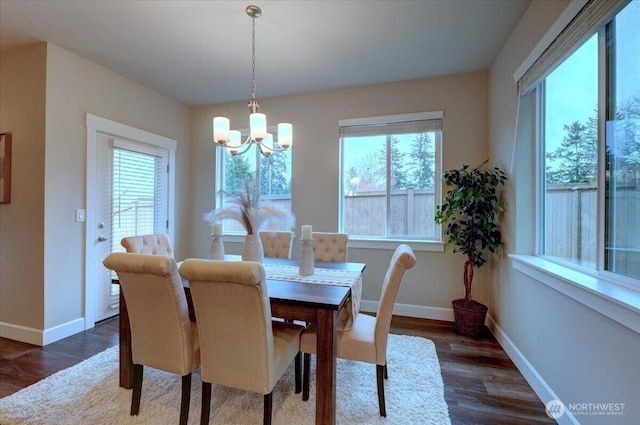 12225 SE 271st Pl, Kent, WA 98030 - dining area featuring baseboards, wood finished floors, and a chandelier