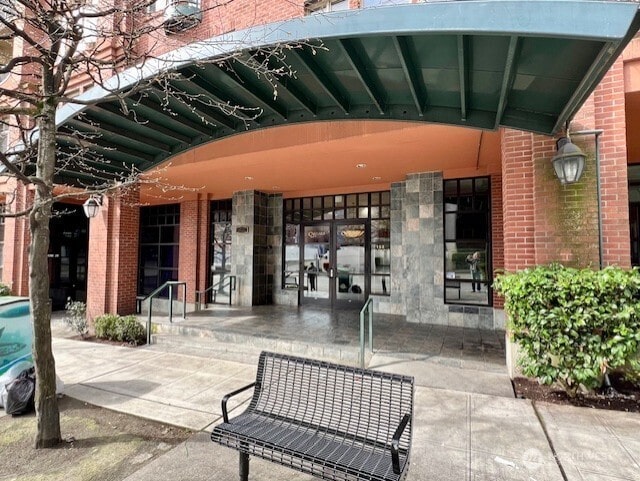 123 Queen Anne Ave N Unit 307, Seattle, WA 98109 - exterior space featuring brick siding and a patio area