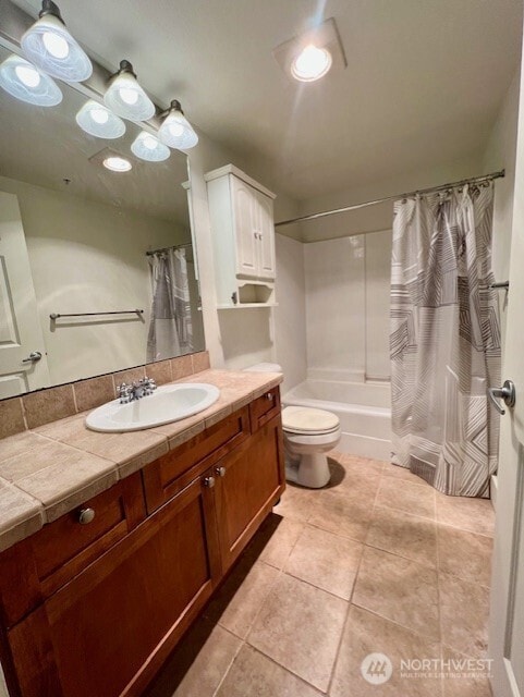 123 Queen Anne Ave N Unit 307, Seattle, WA 98109 - full bathroom with tile patterned flooring, toilet, vanity, and shower / tub combo