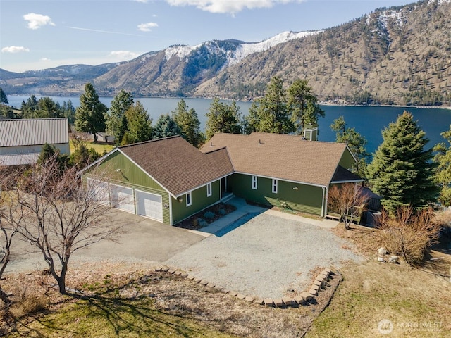 exterior space featuring a water and mountain view