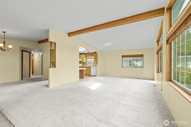 unfurnished living room featuring light carpet, a chandelier, and vaulted ceiling with beams