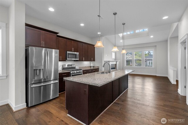 3727 Oakwood St SE, Olympia, WA 98513 - kitchen featuring stainless steel appliances, a sink, dark wood-type flooring, dark brown cabinetry, and light stone countertops