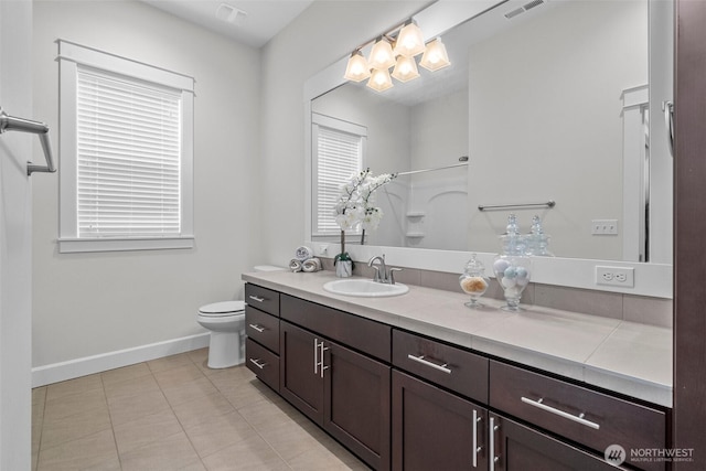 3727 Oakwood St SE, Olympia, WA 98513 - full bathroom featuring baseboards, vanity, toilet, tile patterned flooring, and a shower
