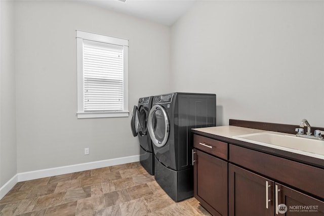 3727 Oakwood St SE, Olympia, WA 98513 - washroom featuring washer and clothes dryer, cabinet space, baseboards, and stone finish flooring