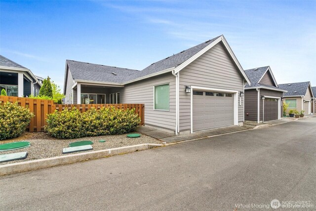 3727 Oakwood St SE, Olympia, WA 98513 - ranch-style home featuring an attached garage and a shingled roof