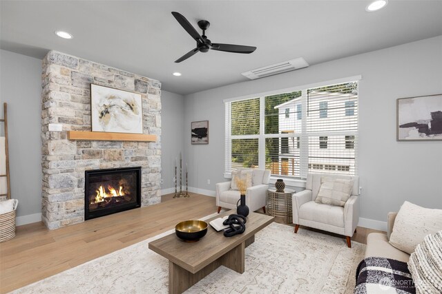 18 160th St SE, Bothell, WA 98012 - living room with wood finished floors, a fireplace, a ceiling fan, and recessed lighting
