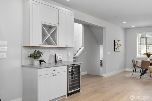 18 160th St SE, Bothell, WA 98012 - bar featuring wine cooler, backsplash, light wood-style flooring, recessed lighting, and stairs