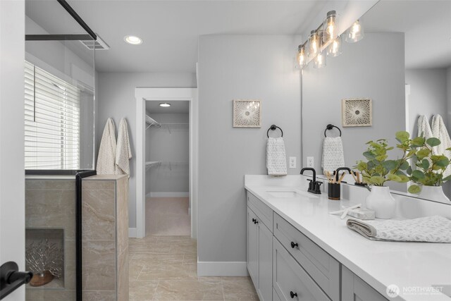 18 160th St SE, Bothell, WA 98012 - bathroom featuring vanity, a spacious closet, and recessed lighting