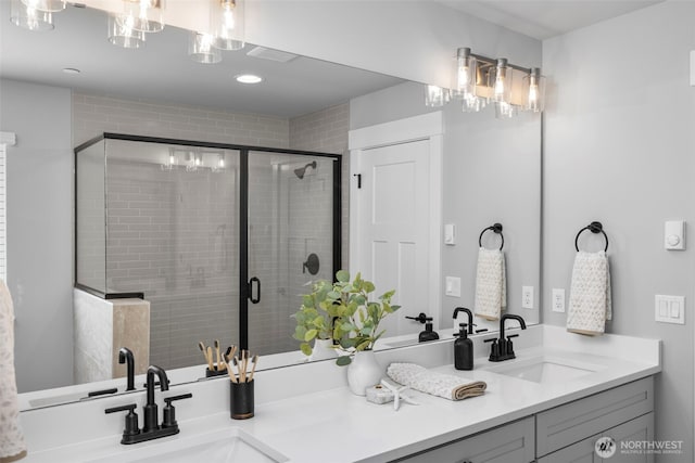 18 160th St SE, Bothell, WA 98012 - bathroom featuring double vanity, a stall shower, and recessed lighting