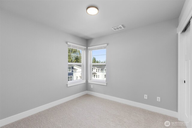 18 160th St SE, Bothell, WA 98012 - spare room featuring light carpet