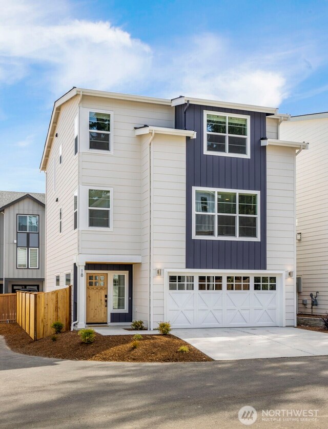 18 160th St SE, Bothell, WA 98012 - view of front of property featuring driveway, a garage, and board and batten siding