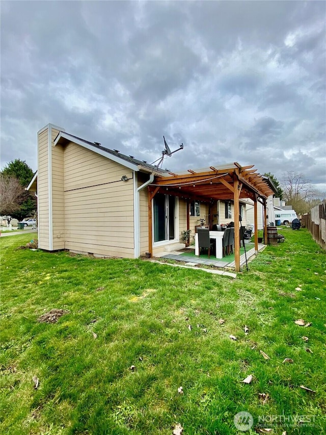 631 6th Ave S, Kent, WA 98032 - rear view of property with a patio area, a lawn, a chimney, and a pergola